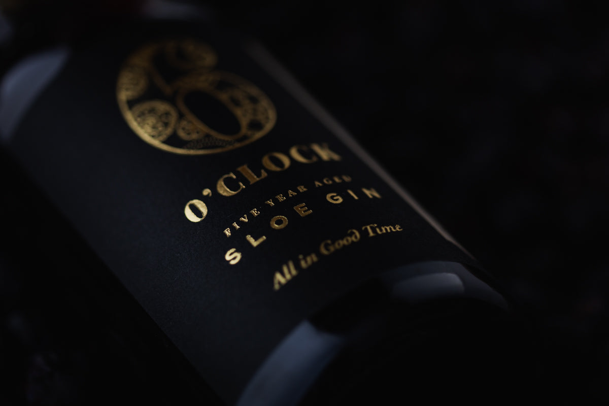 Bottle of Aged sloe gin with a dark background